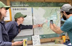 stewards at kaaterskill falls talk to a visitor