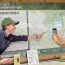 stewards at kaaterskill falls talk to a visitor