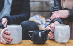 Two people enjoying cups of coffee