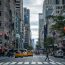 Street in New York City filled with taxis and pedestrians