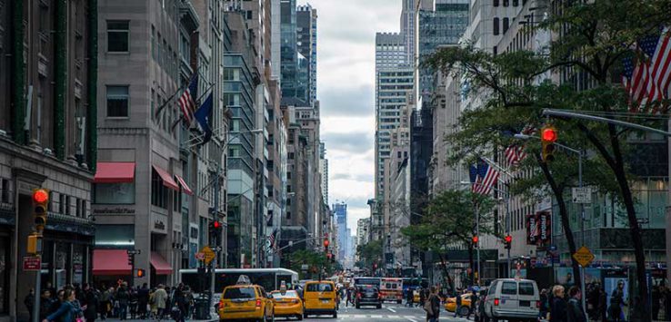 Street in New York City filled with taxis and pedestrians