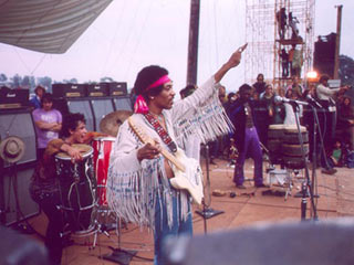Jimi Hendrix on stage at the 1969 Woodstock Music Festival