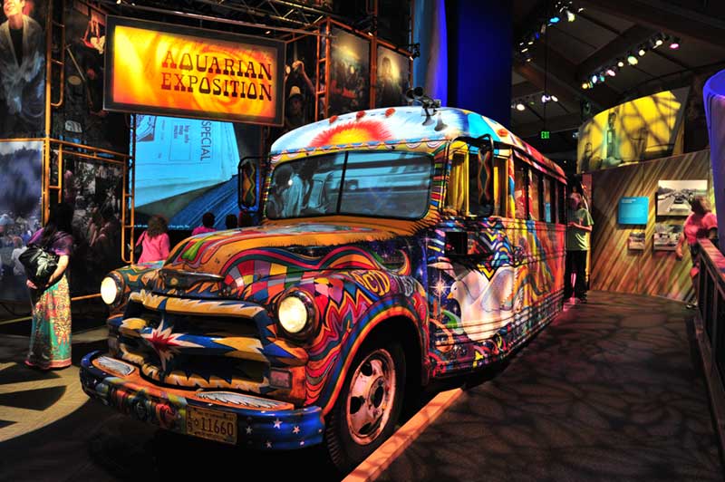 School bus painted with psychadelic motids on display at the Museum at Bethel Woods