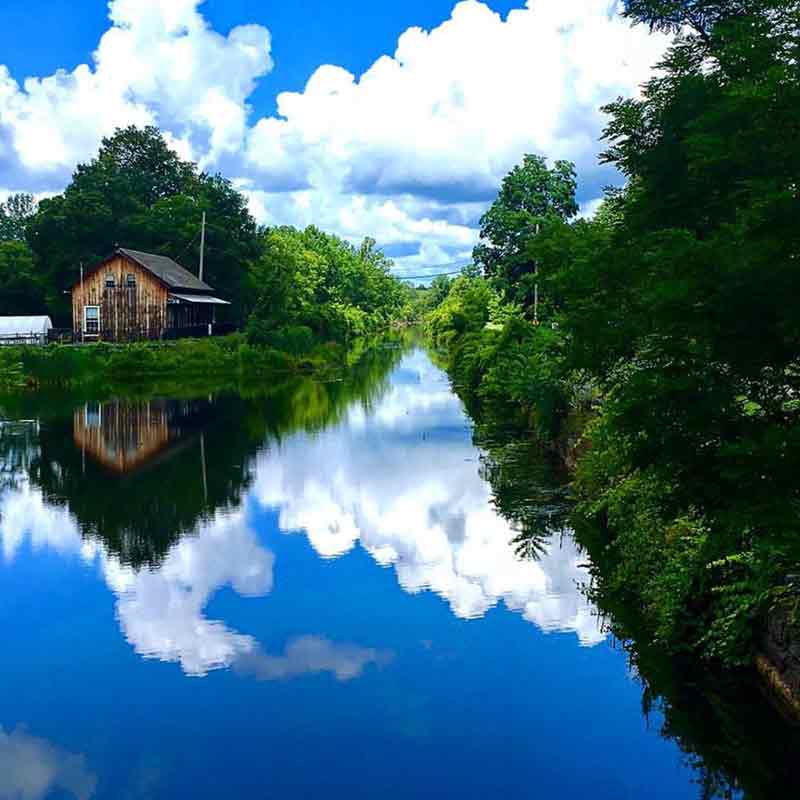 Clouds reflecting on the water at Chittenango Landing Boat Canal Museum