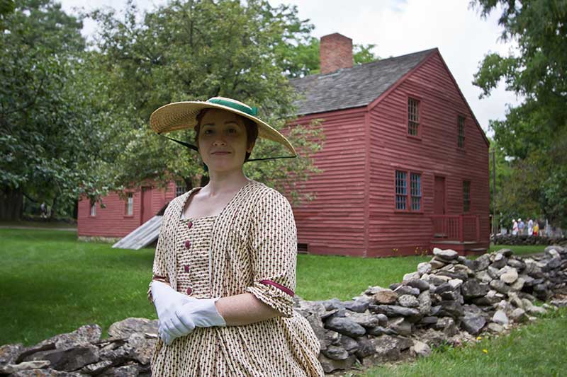 Woman dressed in 1800s clothing at the Genesee Country Village & Museum