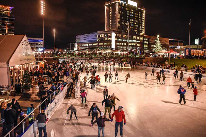 People ice skating at Canalside in downtown Buffalo
