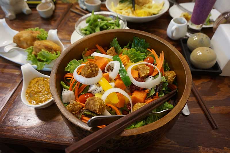 Bowl of vegan stir fry with tempeh