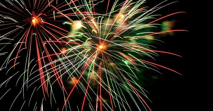 Red and green Fireworks in the night sky