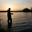 man fishing on a shore