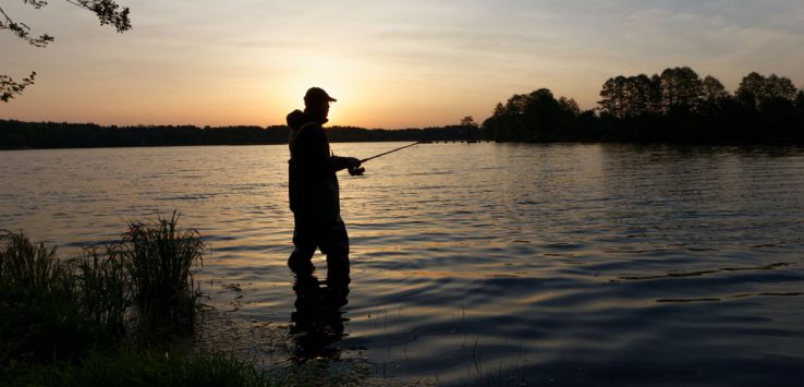 man fishing on a shore