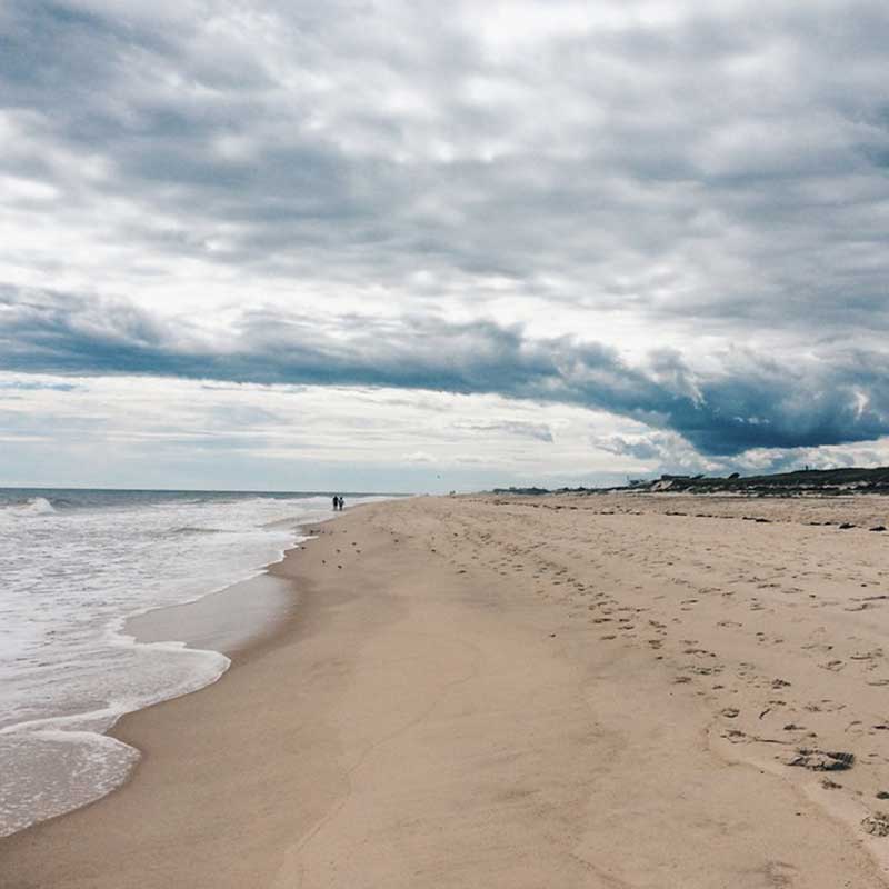 Footprints in the sand on a moody afternoon in Southampton NY